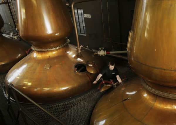 Warehouseman Gregor MacDonald works in the Still House at the Jura whisky distillery on the Scottish island Jura. Picture: PA