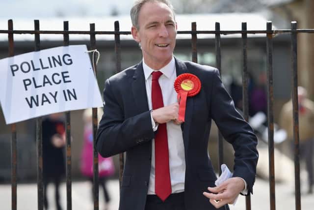 Leader of the Scottish Labour Party Jim Murphy gestures at a polling station to cast his vote in Glasgow, Scotland. Picture: Getty