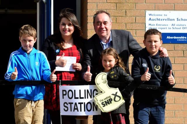 SNP candidate for the Gordon constituency Alex Salmond gives the thumbs up with first time voter Nicki Falconer, and her family. Picture: Getty