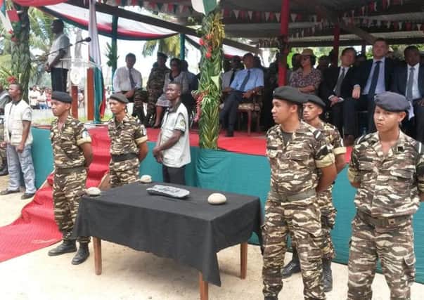 Soldiers guard the treasure found off the Madagascan coast. Picture: @martinvogl/Twitter