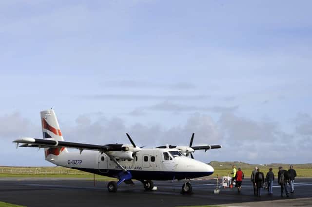 Passengers prepare to board a plane for a flight from Tiree airport. Picture: Ian Rutherford