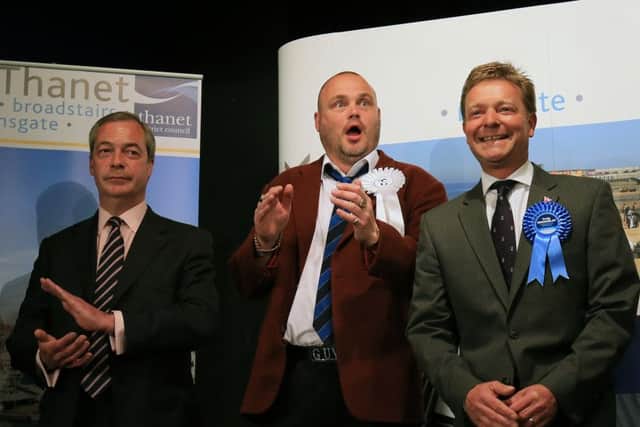 Ukip leader Nigel Farage, left, and FUKP candidate The Pub Landlord Al Murray listen to the Conservative candidate Craig Mackinlay (right) receive his declaration results. Picture: PA