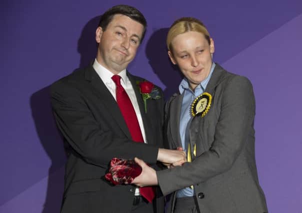 Newly-elected member of Parliament, Mhairi Black, Britain's youngest member of parliament since 1667, greets Labour candidate Douglas Alexander. Picture: Getty