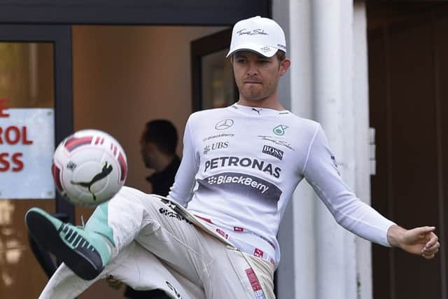 Nico Rosberg indulges in a bit of keepie-uppie before the first practice session. Picture: Getty