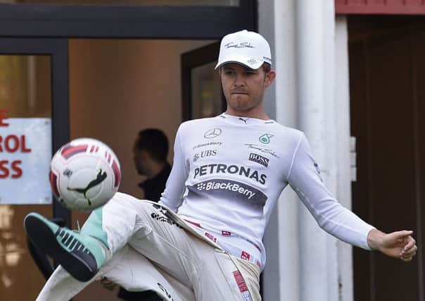 Nico Rosberg indulges in a bit of keepie-uppie before the first practice session. Picture: Getty