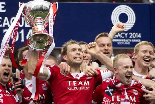 Retiring Aberdeen captain Russell Anderson lifted the Scottish League Cup last season. Picture: SNS