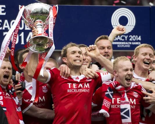 Retiring Aberdeen captain Russell Anderson lifted the Scottish League Cup last season. Picture: SNS