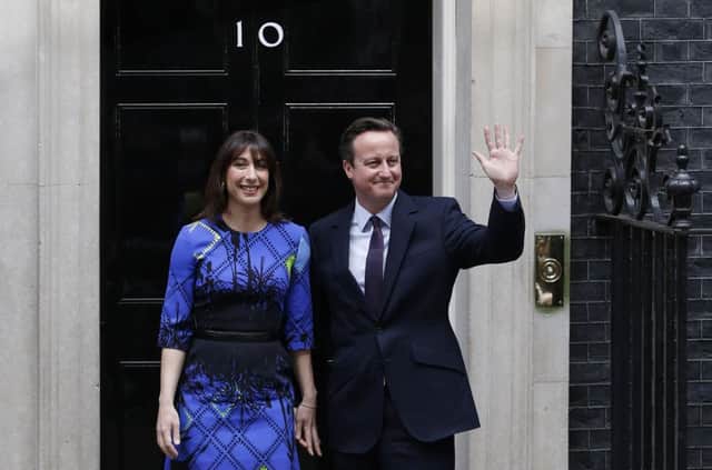 David Cameron and his wife Samantha pose for pictures outside 10 Downing Street. Picture: Getty
