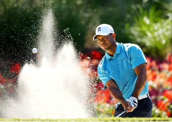 Tiger Woods plays his shot out of a bunker at the 14th hole of his second round at Sawgrass. Picture: Getty
