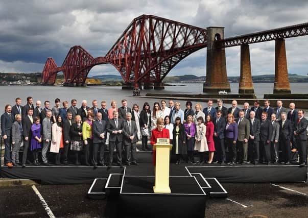 Nicola Sturgeon with the SNP's 56 MPs at South Queensferry, against the backdrop of the Forth Bridge. Picture: Getty