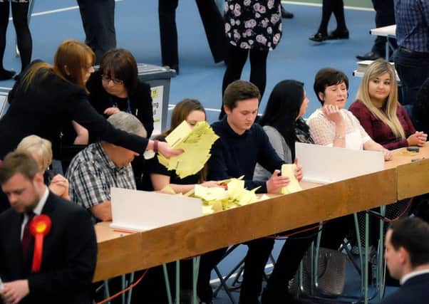 Ballot papers are counted on Thursday night. Picture: Getty