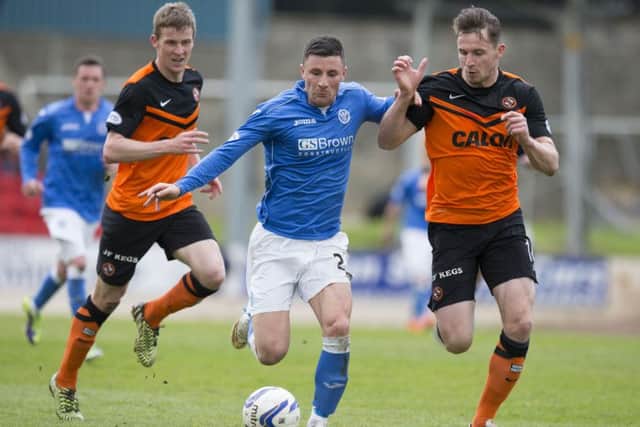 St Johnstone's Michael O'Halloran, centre, runs from Dundee United's Callum Morris. Picture: SNS
