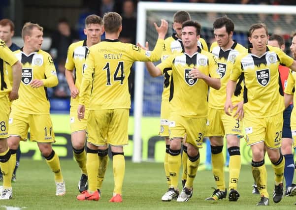 St Mirren's Stephen Mallan, centre, celebrates as he equalises for his side. Picture: SNS