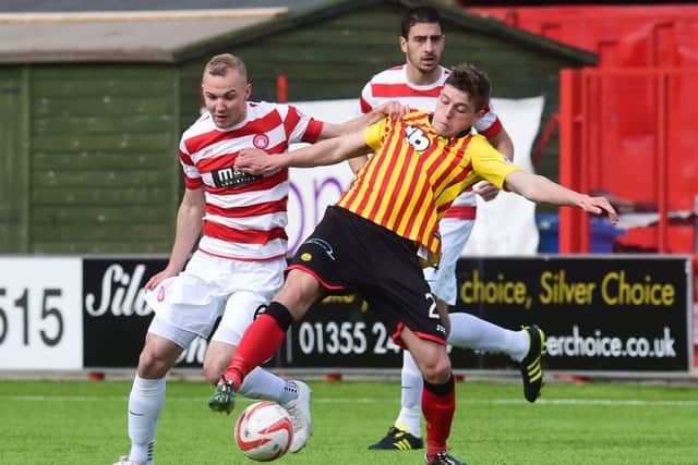 Hamilton's Grant Gillespie (left) battles with Gary Fraser. Picture: SNS