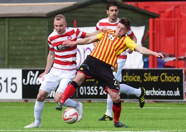 Hamilton's Grant Gillespie (left) battles with Gary Fraser. Picture: SNS