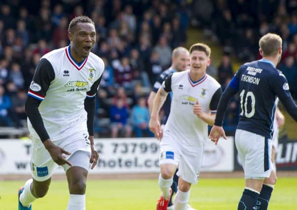 Inverness' Edward Ofere wheels away to celebrate his goal. Picture: SNS