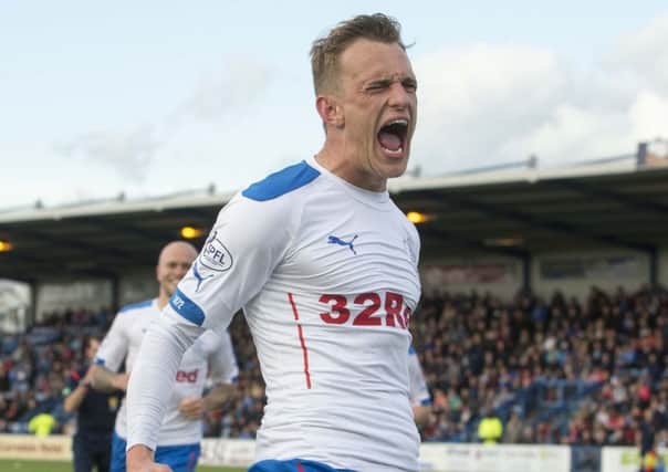 Dean Shiels celebrates netting the winning goal on the night. Picture: PA