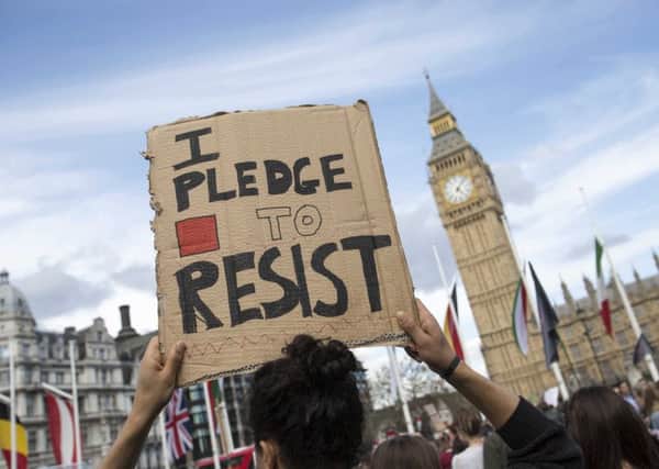 Demonstrators pictured during the anti-austerity protest in central London. Picture: PA