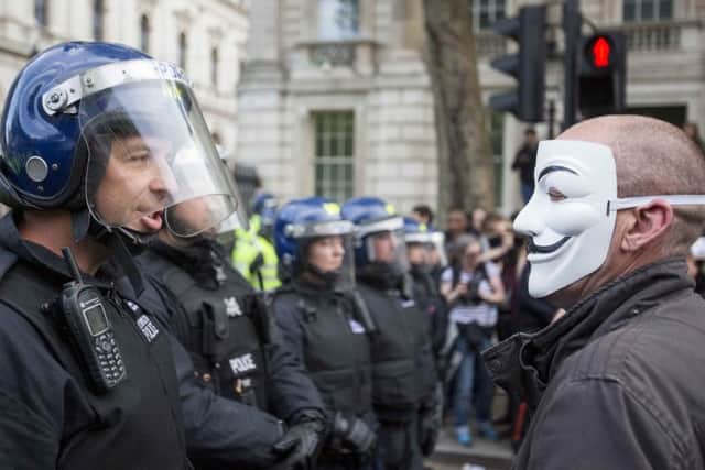 Police and demonstrators pictured during the anti-austerity protest in central London. Picture: PA