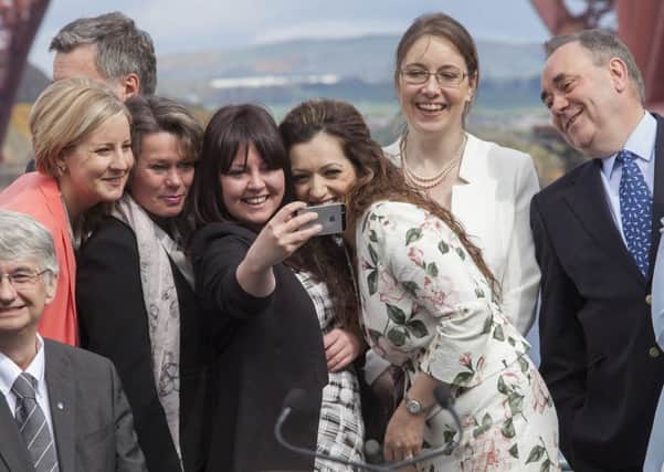 SNP MP Tasmina Ahmed-Sheikh poses for a selfie with fellow MPs Hannah Bardell, Michelle Thomson, Natalie McGarry as Alex Salmond looks on. Picture: SWNS