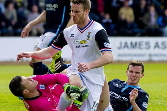 Caley Thistle's Marley Watkins clashes with Dundee goalkeeper Kyle Letheren and Paul McGinn. Picture: SNS