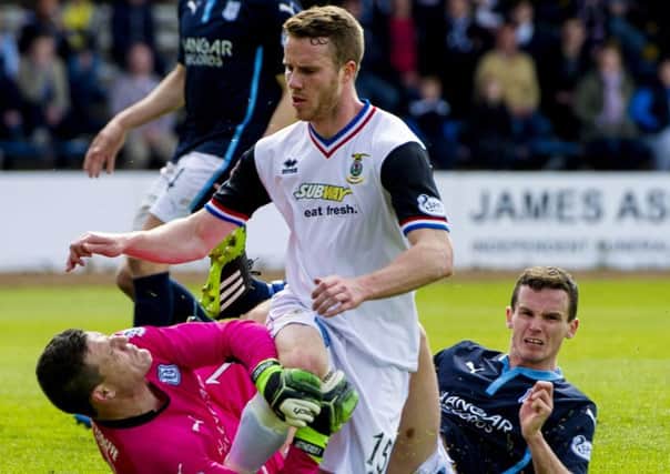 Caley Thistle's Marley Watkins clashes with Dundee goalkeeper Kyle Letheren and Paul McGinn. Picture: SNS