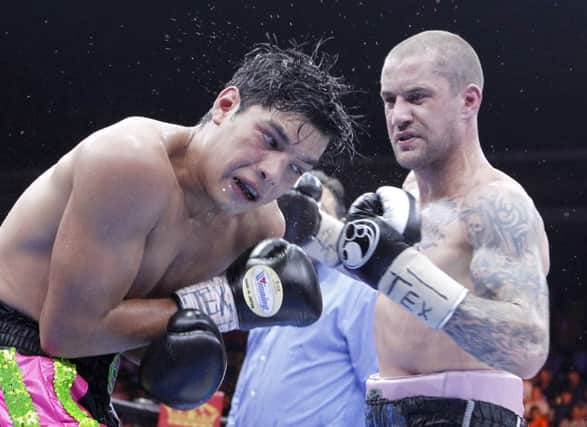 Ricky Burns lands a blow in the last round of the fight but was already well behind on the judges' scorecards. Picture: AP