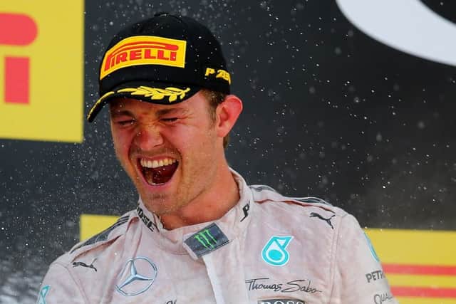 German Mercedes driver Nico Rosberg celebrates on the podium after claiming victory in Barcelona. Picture: Getty