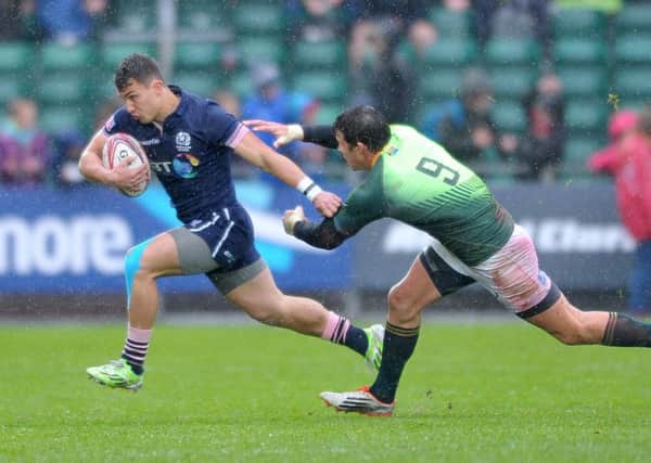 Scotland's Damien Hoyland bursts clear against South Africa. Picture: Jane Barlow