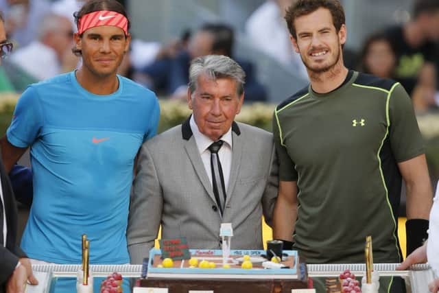 Nadal and Murray pose with former Spanish tennis ace Manolo Santana, prior to the match. Picture: AP