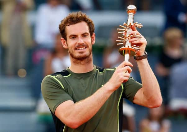 Andy Murray holds the winners trophy after his victory over Rafael Nadal in the Mutua Madrid Open final. Picture: Getty