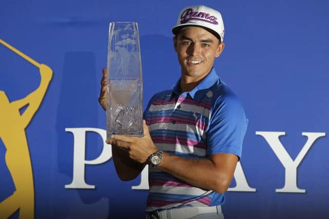Rickie Fowler won in a sudden death play-off against Kevin Kisner to take home The Players Championship trophy. Picture: AP