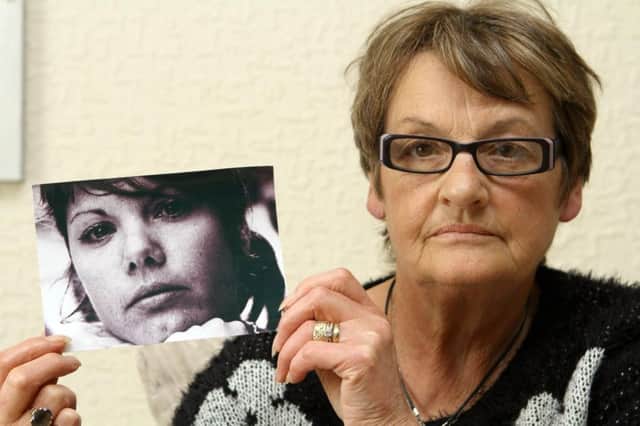 Linda Speirs holds a picture of her daughter Charmain, who was found dead in a hotel. Picture: Hemedia