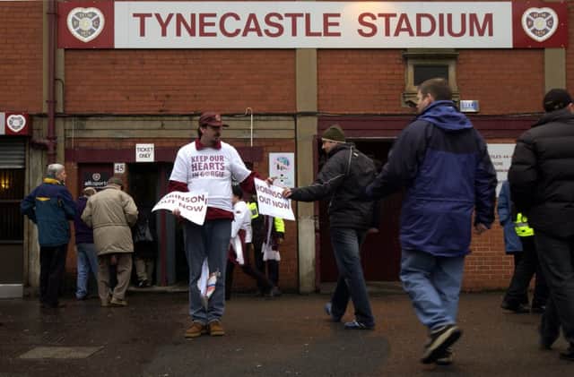 A fan campaigns to keep Hearts at their Tynecastle home. Picture: Phil Wilkinson