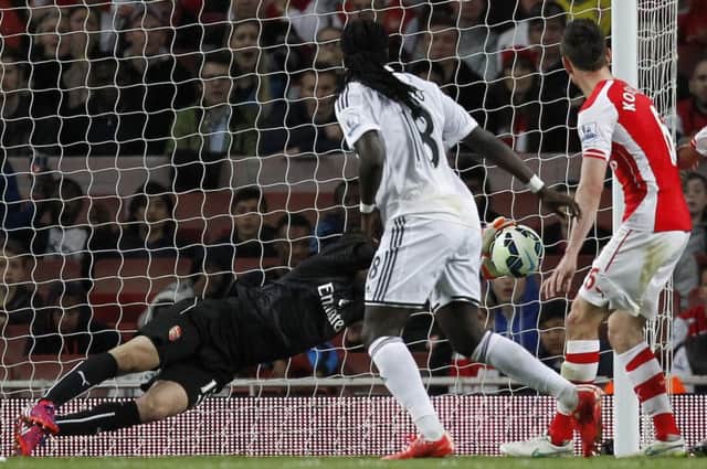 Arsenal goalkeeper David Ospina can't keep out Bafetimbi Gomis's late headed winner. Picture: AFP/Getty