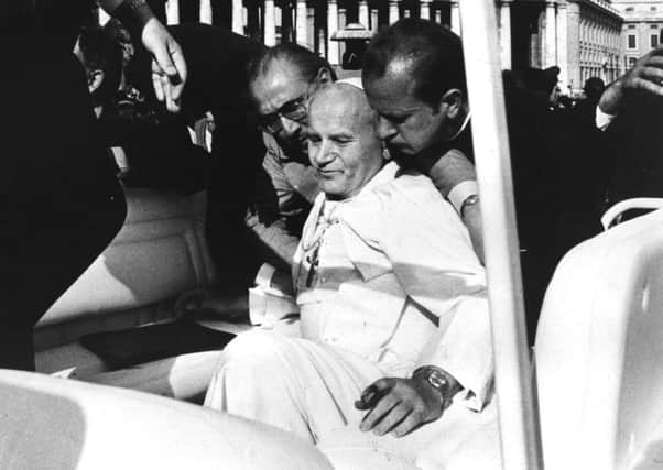 Pope John Paul II moments after the assassination attempt by a Turkish terrorist in St Peter's Square. Picture: Getty Images