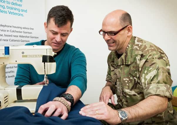 Great British Sewing Bee star Lt Col Neil Stace helps veteran Duncan Welton, a resident of Mike Jackson House.