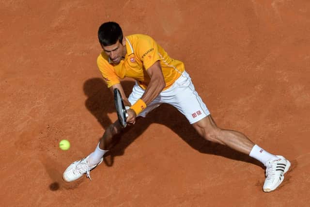 Defending Italian Open champion Novak Djokovic hits a return on his way to victory over Nicolas Almagro in Rome yesterday. Picture: AFP/Getty