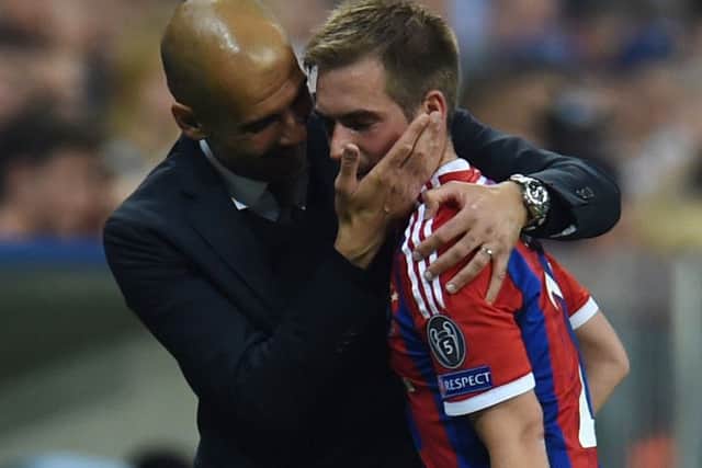 Bayern Munich's Pep Guardiola consoles Philipp Lahm during the match. Picture: Getty