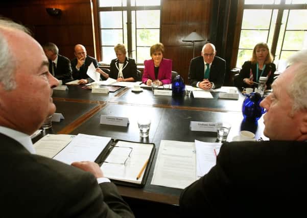 First Minister Nicola Sturgeon, centre, and Deputy First Minister John Swinney attend a STUC bi-annual meeting. Picture: PA