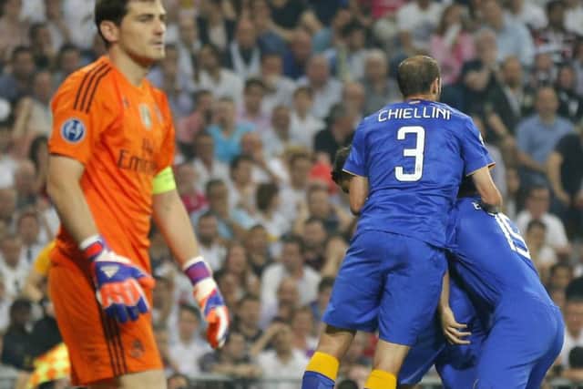 A dejected Iker Casillas as Juventus players celebrate reaching the Champions League final. Picture: AP