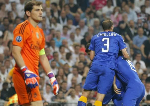 A dejected Iker Casillas as Juventus players celebrate reaching the Champions League final. Picture: AP