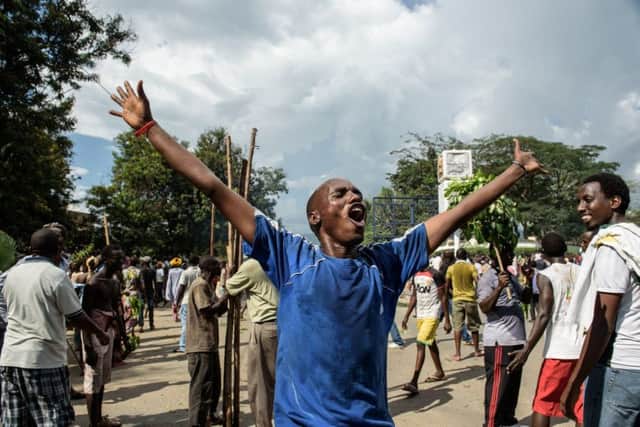 People celebrate on the streets of Bujumbura after hearing that President Nkurunziza had been overthrown. Picture AFP/Getty