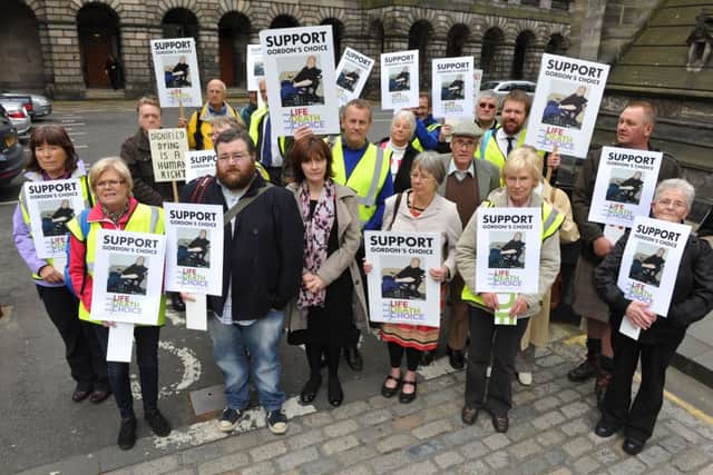 Supporters of 66-year-old disabled grandfather Gordon Ross gathered today in Parliament Square, Edinburgh. Picture: Ian Rutherford