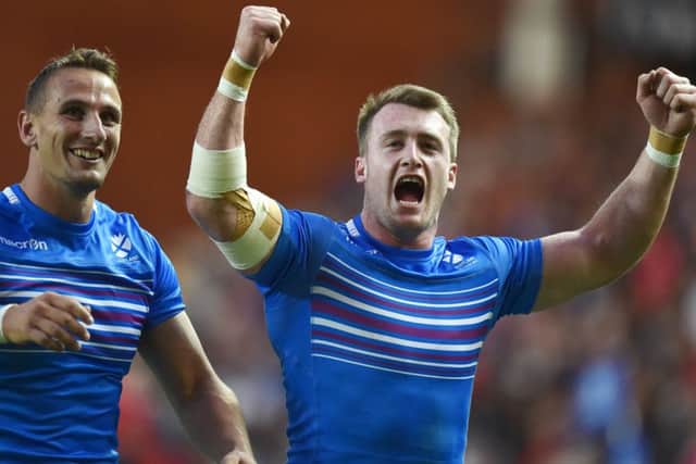 Stuart Hogg, right, celebrates with Colin Shaw after Scotland defeated Canada at the Glasgow 2014 Commonwealth Games. Picture: Ian Rutherford