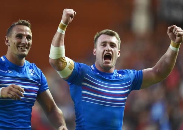 Stuart Hogg, right, celebrates with Colin Shaw after Scotland defeated Canada at the Glasgow 2014 Commonwealth Games. Picture: Ian Rutherford