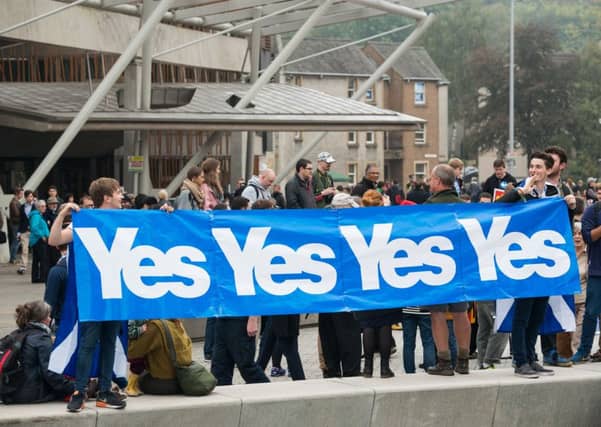 Pro-independence supporters campaign outside the Scottish Parliament in September 2014. Picture: Ian Georgeson