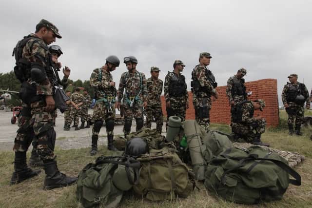 Nepalese army soldiers prepare to take part in the search for the missing helicopter. Picture: AP