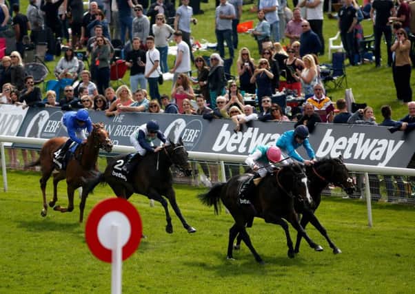 SnowSky, with Ryan Moore on board, gets the better of Brown Panther. Picture: Getty