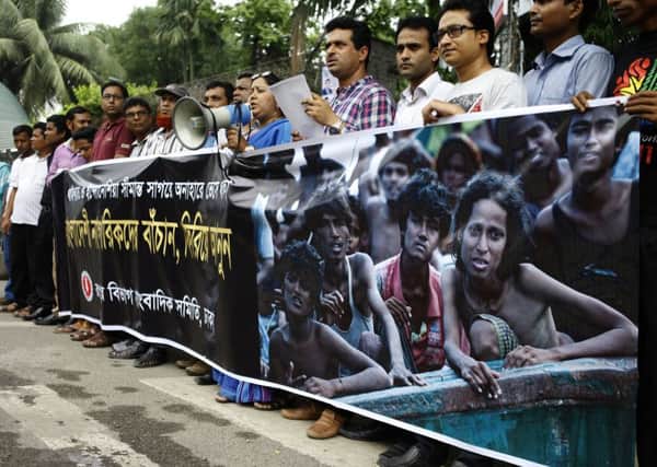 A protest in Dhaka demanding the safe return of migrant Bangladeshis who are floating on boats in the Andaman Sea. Picture: Shafiqul Alam/Demotix